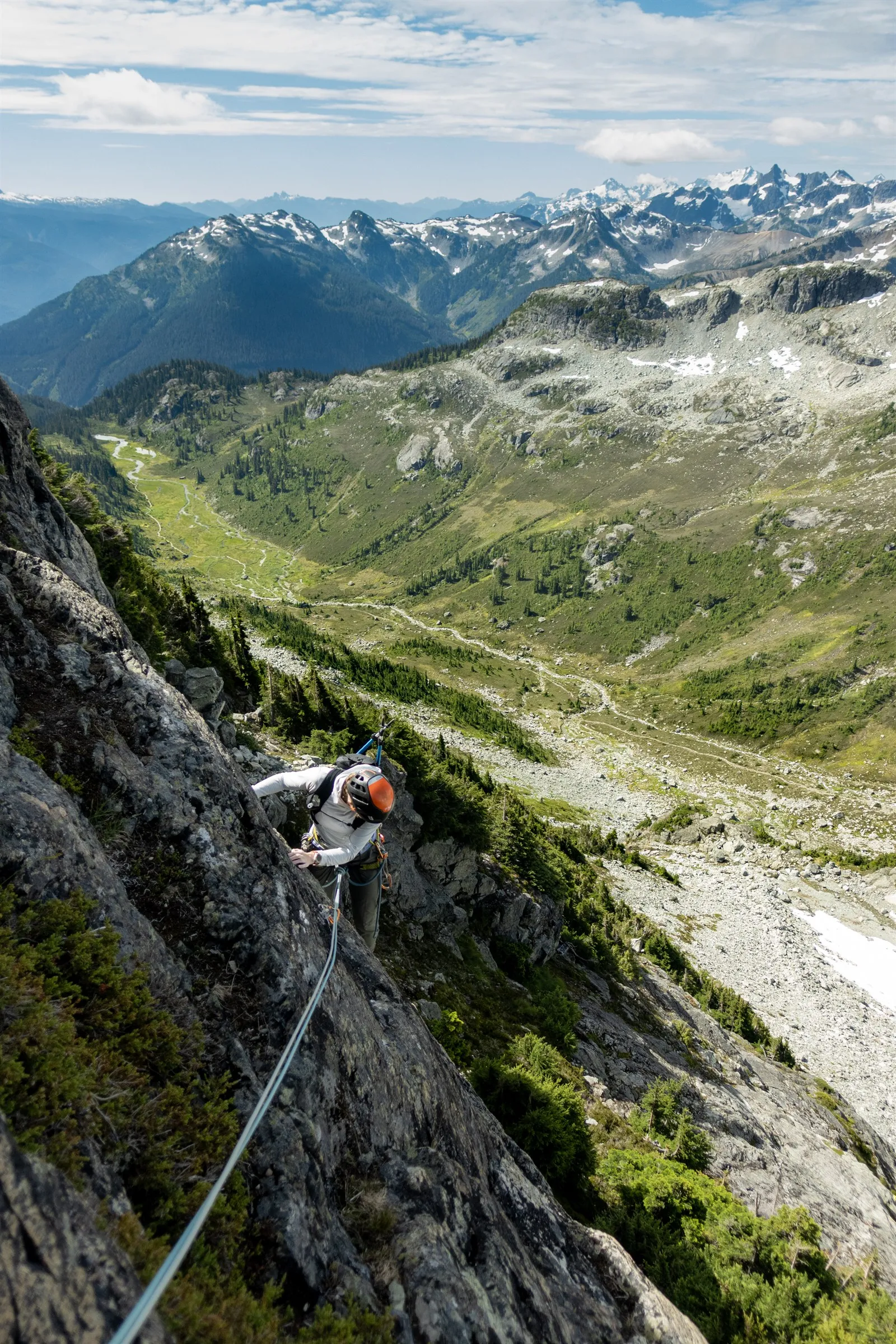 Linsey climbing Bastardo above the broad green valley of Brandywine Meadows